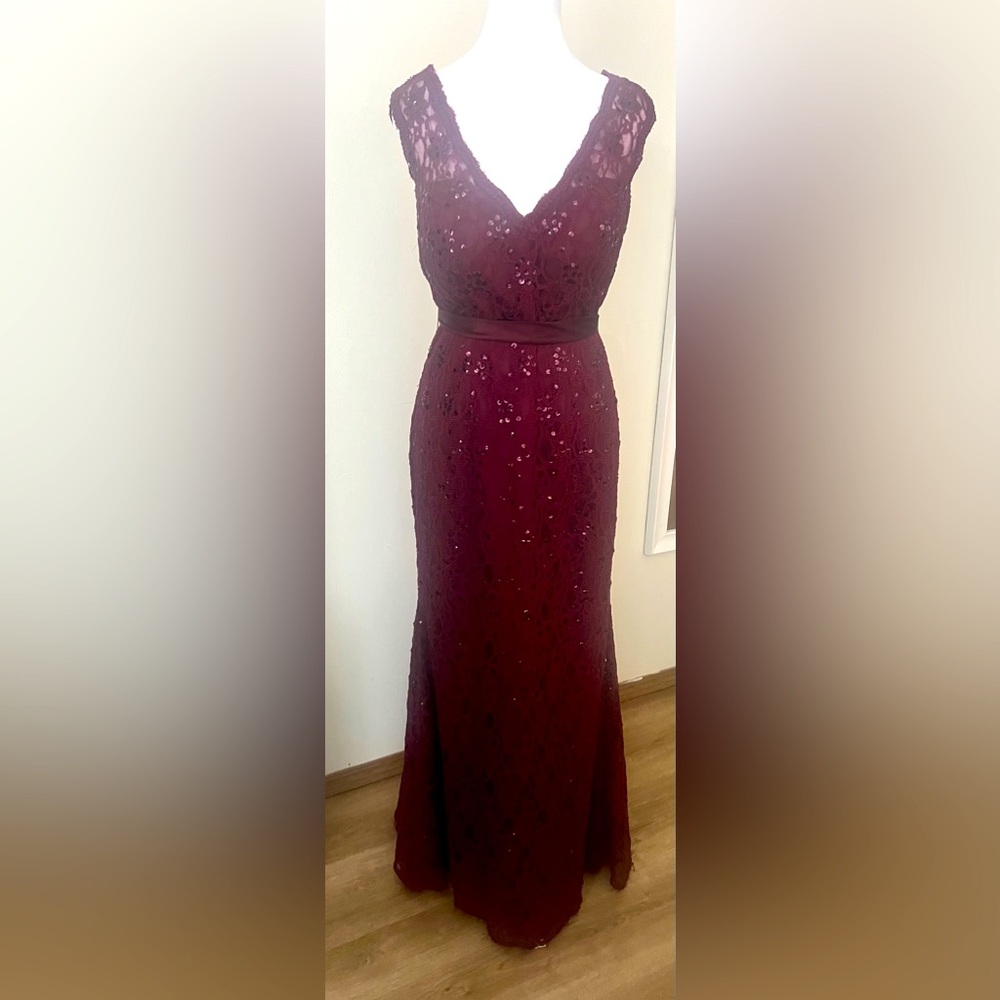 Merlot laced formal gown. Sequence embellishment on lace. Ribbon waist